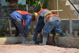 Belize construction workers working on foundation – Best Places In The World To Retire – International Living